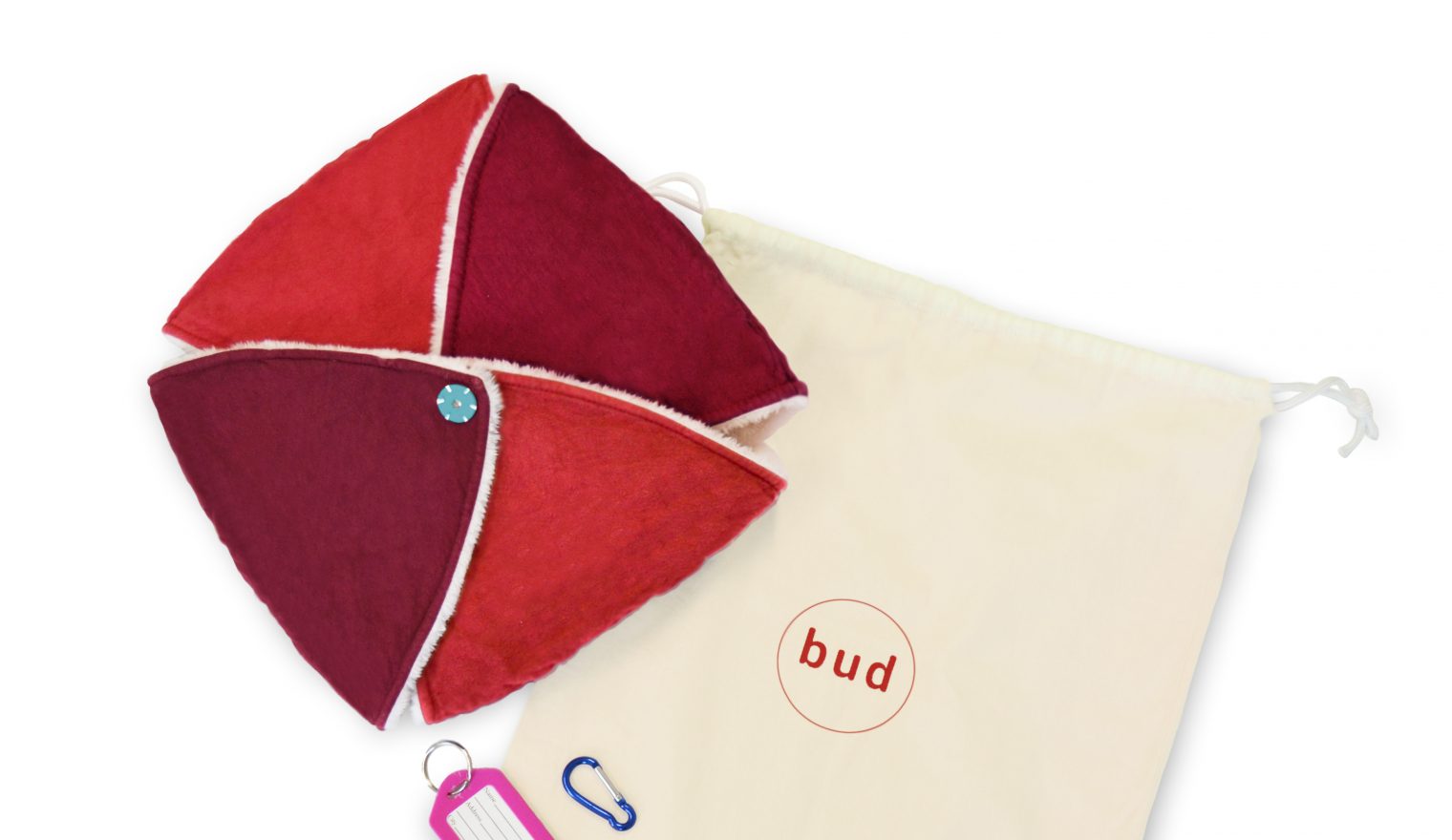 A Bud sensory cushion closed up with a carry bag and accessories