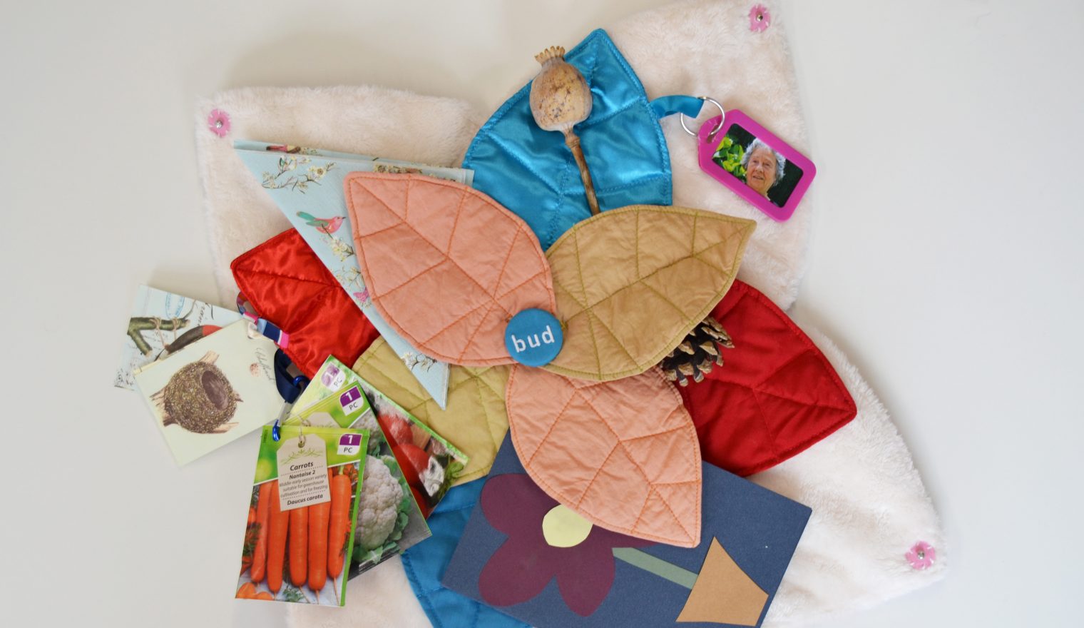 An open Bud sensory cushion featuring items relating to gardening